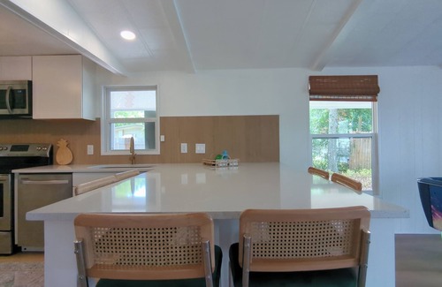 Cocoa House | Newly renovated home with air hockey, games, huge TV wall,fenced yard+screenroom