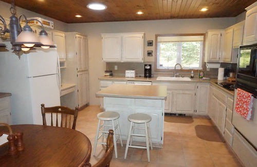 Solon Springs Cabin | Northwoods lake home with gentle slope to clear lake with sandy beach
