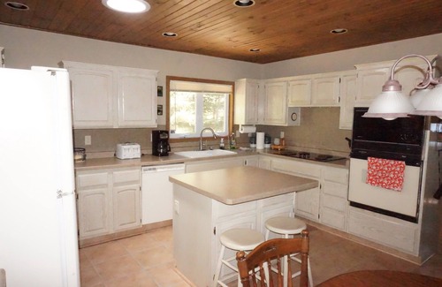 Solon Springs Cabin | Northwoods lake home with gentle slope to clear lake with sandy beach