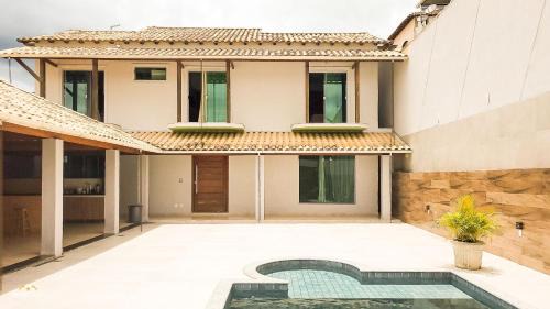 Bom Pastor House | NossoApê Guarua: Piscina | Churrasqueira | Ar-condicionado