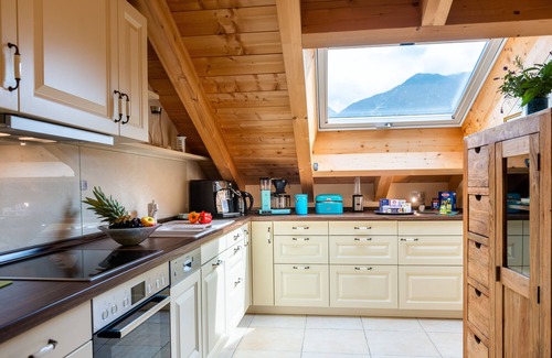 Garmisch-Partenkirchen Apartment | Open top floor apartment with exposed roof structure