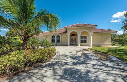 Palm River Estates Villa | Palms and Pool home in Naples best beaches and national parks