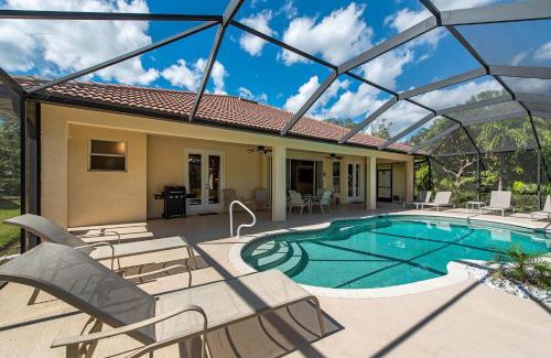 Palm River Estates Villa | Palms and Pool home in Naples best beaches and national parks