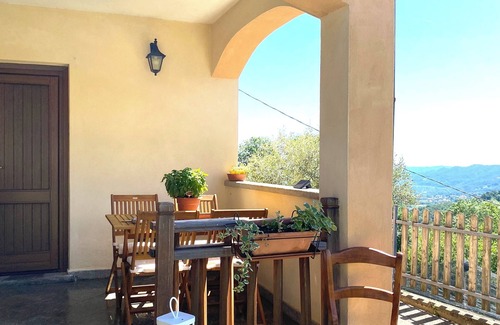 Sanfront House | Panoramic two-story dwelling with private garden, surrounded by green woods.