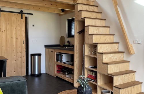 Olburgen House | Pawradise - Charming TinyHouse on the water in Olburgen | Romance & Adventure