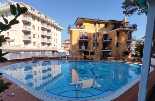 Eraclea Mare Apartment | Pine forest front apartment with swimming pool max 5 people wi-fi