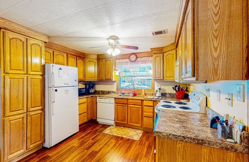 Ellenton House | Private community home with on-site pool, screened patio, central AC, & W/D