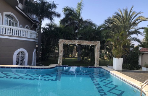 Al-'Amriyah Condo | Private resort type condo setting with full access to garden and pool