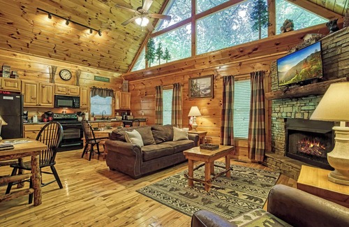 Gatlinburg - Pigeon Forge Cabin | Private Wooded Setting! Theater Room! Centrally Located! 3 Decks! Fun Game Room