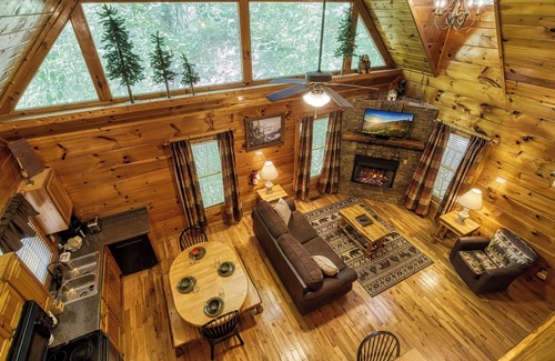 Gatlinburg - Pigeon Forge Cabin | Private Wooded Setting! Theater Room! Centrally Located! 3 Decks! Fun Game Room