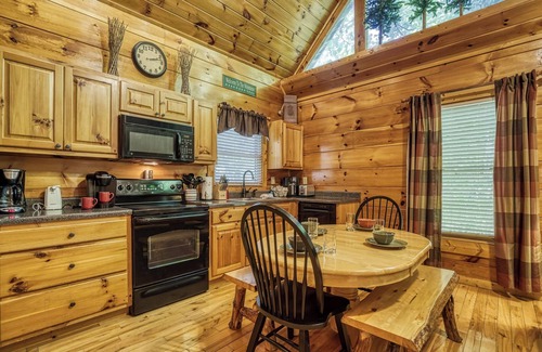 Gatlinburg - Pigeon Forge Cabin | Private Wooded Setting! Theater Room! Centrally Located! 3 Decks! Fun Game Room