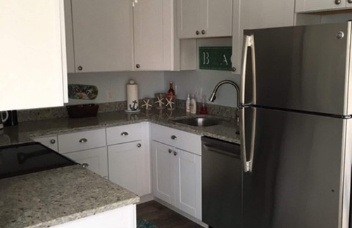 Ocean Pines Cottage | Pura Vida.Canal front beach cottage with private dock and sleeps 8