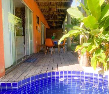 Pescaria Apartment | Quarto e sala com piscina em Maceió - Villas Tulipa 02