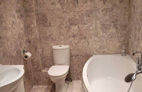 Sherborne St. John House | Reasonably large room with luxurious bathroom and a fitted kitchen
