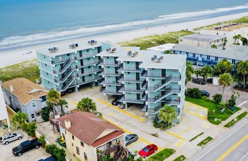 Jacksonville Condo | Relax and enjoy the ocean view on the balcony. Just 15 minutes to Mayo Clinic