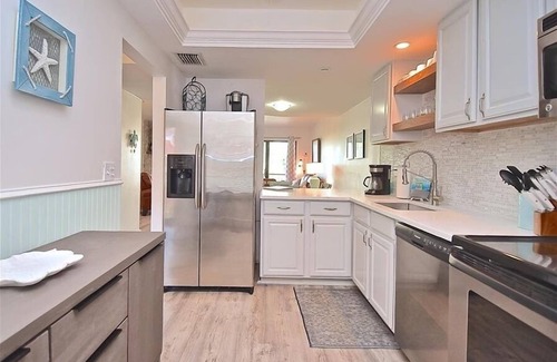 Siesta Key Condo | Relax at Cozy Cove! Waterfront w/Large Pool & Boat Dock. Short walk to Turtle Beach. CC4