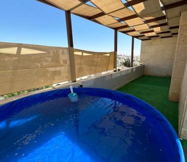 Amman Apartment | Rooftop pool with terraces F-R