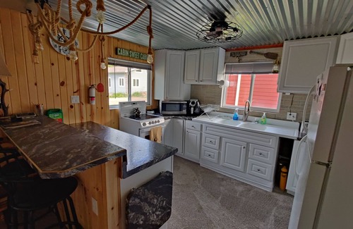 Ventura House | Rustic and charming two-bedroom home a block from the lake and park!