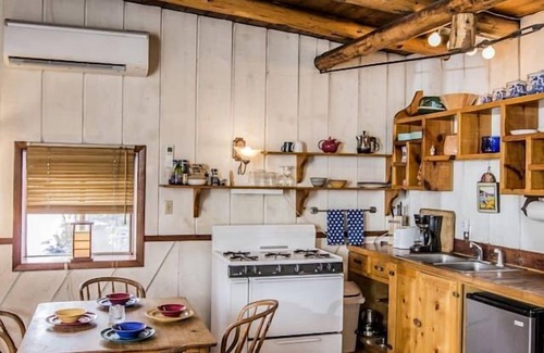 San Cristobal Cabin | Rustic Log Cabin on Eco-Friendly Farm near Taos, New Mexico