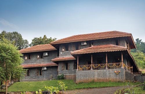 Ambavna Villa | SaffronStays Niramay, Torna-Rajgad - rustic pool villa with a gazebo and great forest views
