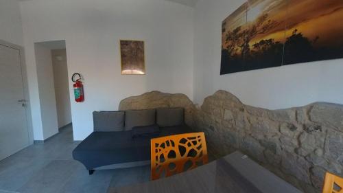 Sant'Antioco House | Sant Antioco Yellow Apartment with 2 Way Air Con