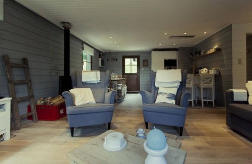 Buellingen Ski Chalet | Scandinavian chalet in lush greenery and forest .