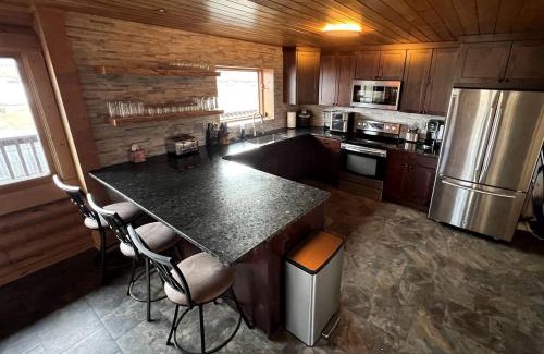 Ennis House | Scenic Vacation Home with Wrap-Around Deck Overlooking Ennis Lake near McAllister, Montana