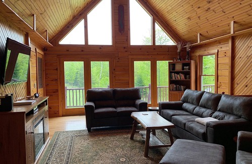 Johnsburg House | Secluded Log Cabin with hot-tub. Near Lake George. Amazing Mt View. Sleeps 15