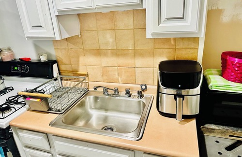 Coram Apartment | Serenity Haven: Cozy 2-Bedroom Home with Spacious Living & Big Backyard