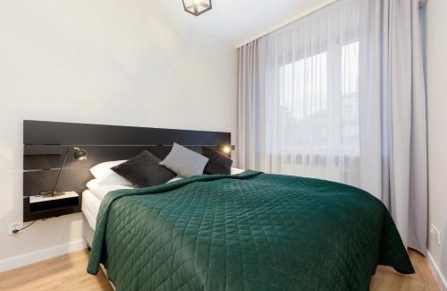 Gorce Apartment | Spacious Apartment in Warsaw with Balcony and Parking by Noclegi Renters