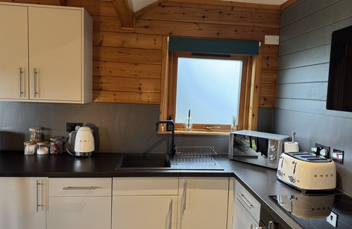 Pitlochry Cabin | Spacious Lodge with woodburner, hot tub and beautiful views from the patio deck.