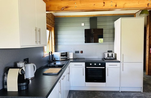 Pitlochry Cabin | Spacious Lodge with woodburner, hot tub and beautiful views from the patio deck.