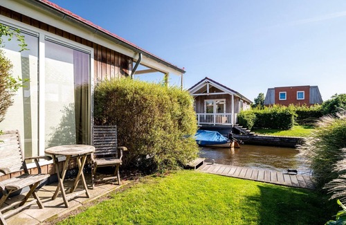 Akkrum House | Stay in our cozy Meine 4 chalet with private jetty.