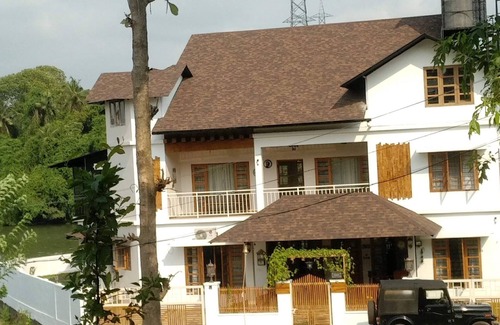 Kakkanad House | Stay In the city. But in a village ambience. Over looking the forest