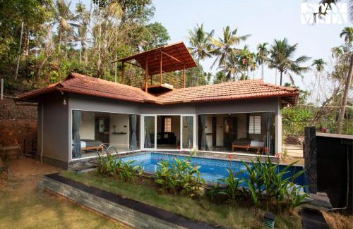Mananthavady Villa | StayVista at Palm Tree Homes with Complimentary Breakfast, BBQ Grill and Pet-Friendly Home