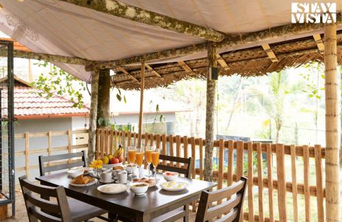 Mananthavady Villa | StayVista at Palm Tree Homes with Complimentary Breakfast, BBQ Grill and Pet-Friendly Home