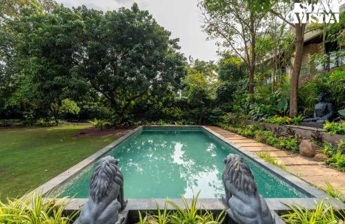 Parshwapuram Villa | StayVista's House Of J - Embrace Leisure with Lawn, Pool, and Gazebo