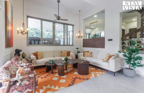 Parshwapuram Villa | StayVista's House Of J - Embrace Leisure with Lawn, Pool, and Gazebo
