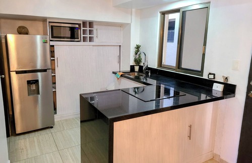 Luis Donaldo Colosio House | Steps from the beach 3-bedroom plus loft bedroom townhome, WiFi, AC & roof top.