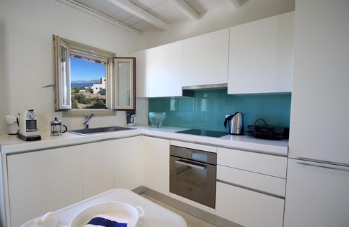 Chrissi Akti House | Stone sea view house with a beautiful garden close to an amazing sandy beach