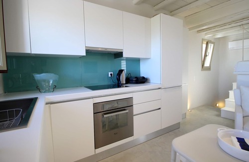 Chrissi Akti House | Stone sea view house with a beautiful garden close to an amazing sandy beach