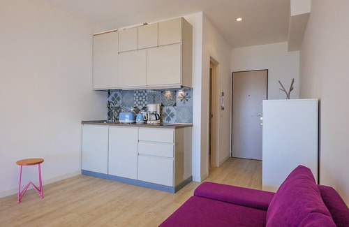 Susello Apartment | Studio with sunny balcony in a residence with pool