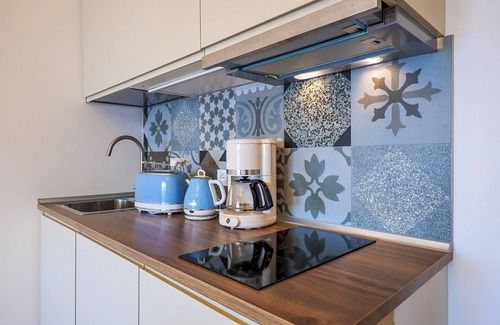 Susello Apartment | Studio with sunny balcony in a residence with pool