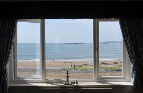 Rhosneigr House | Stunning bay views and sunsets seen from all main rooms. Games room. Wetroom.