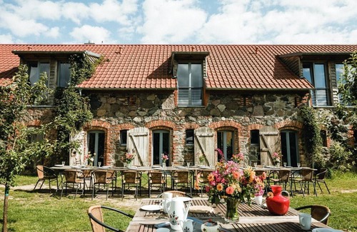 Hirschfelde House | Stylishly furnished fieldstone barn with dining room and terrace by the village pond