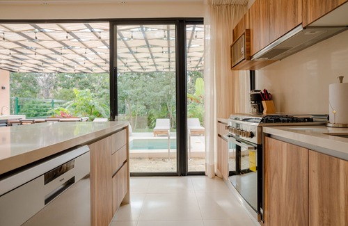 Tulum House | Sun-soaked & modern beach getaway with pool, generous patio, gym, & great views