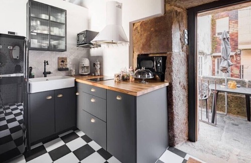 Corcubion Apartment | The 20's Suite. Loft with bathtub, outdoor terrace and wood-burning fireplace.