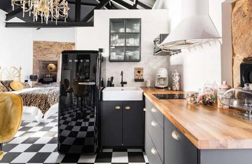 Corcubion Apartment | The 20's Suite. Loft with bathtub, outdoor terrace and wood-burning fireplace.