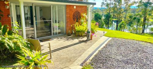 Urunga House | The Glade, peace among the trees on the river