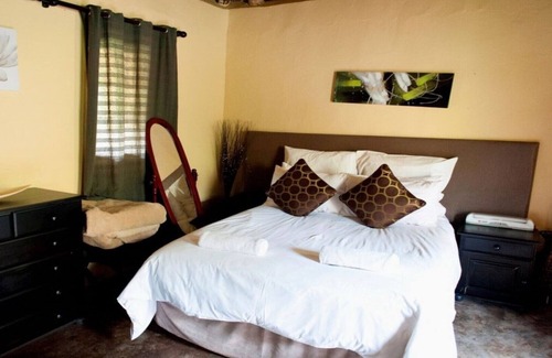 Hlotse House | The Queen-Size-Bed Riverside Huts